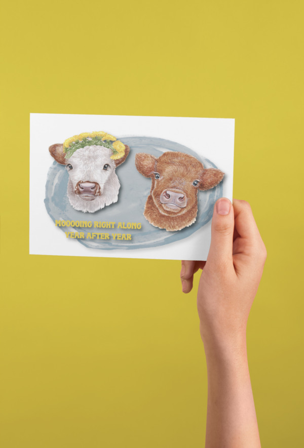 yellow background with person hold card up in the air showing a funny farm anniversary card featuring cows