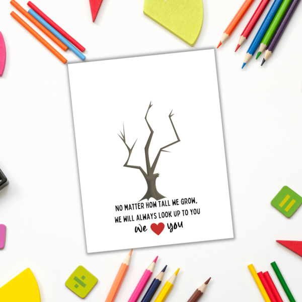 white desk with coloring pencils with tree handprint art