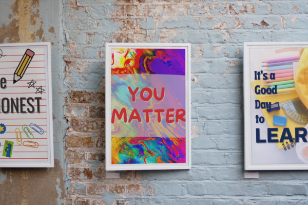 Framed You Matter poster on a brick background