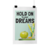 Hold On To Your Dreams poster hanging in front of a white background