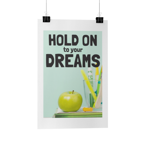 Hold On To Your Dreams poster hanging in front of a white background