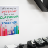In This Classroom We Are Together poster on a white wall over a desk