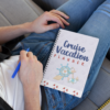 person sitting on couch, planning cruise vacation with planner in lab
