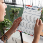 Lady looking over the Party Planner Page from the Floral Christmas Planner