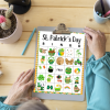 pale wood table with clipboard cup of pens and pen sitting next to the bingo board on the clipboard with senior hands hold the board to play the game