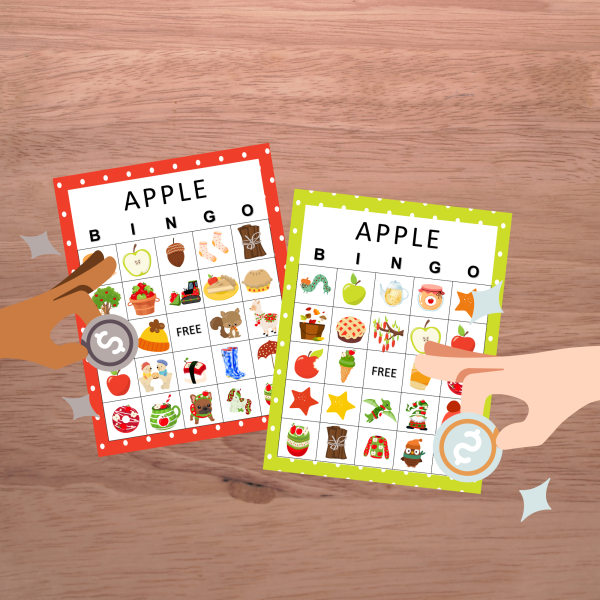 wood background with green and red apple bingo boards and two players placing a coin cover down on the board