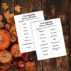 wood table with pumpkins and leaves shows the pages printed out on the table with items like a plaid blanket, corn bread, sweet potatoes, jumping into a pile of leaves.