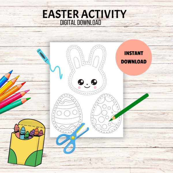 white table with Easter Activity Digital Download, peach bubble Instant Download, shows page with bunny and eggs have dashed lined around images with crayons and scissors on page and coloring pencil