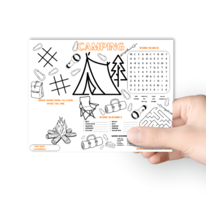white background, with hand holding the camping party activity mat, green circle that says Letter Size. Shows activities of maze, word search, word scramble, tic tac toe, and coloring and drawing.