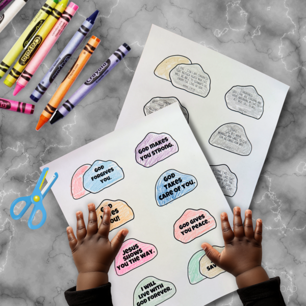 grey marble table, shows crayons, and scissors, with the rocks colored and hands ready to cut them out. Shows Eternal Life, Peace, Forgiveness, I will live with god forever, Jesus shows you the way, god loves you, god forgives you, provisions, etc.